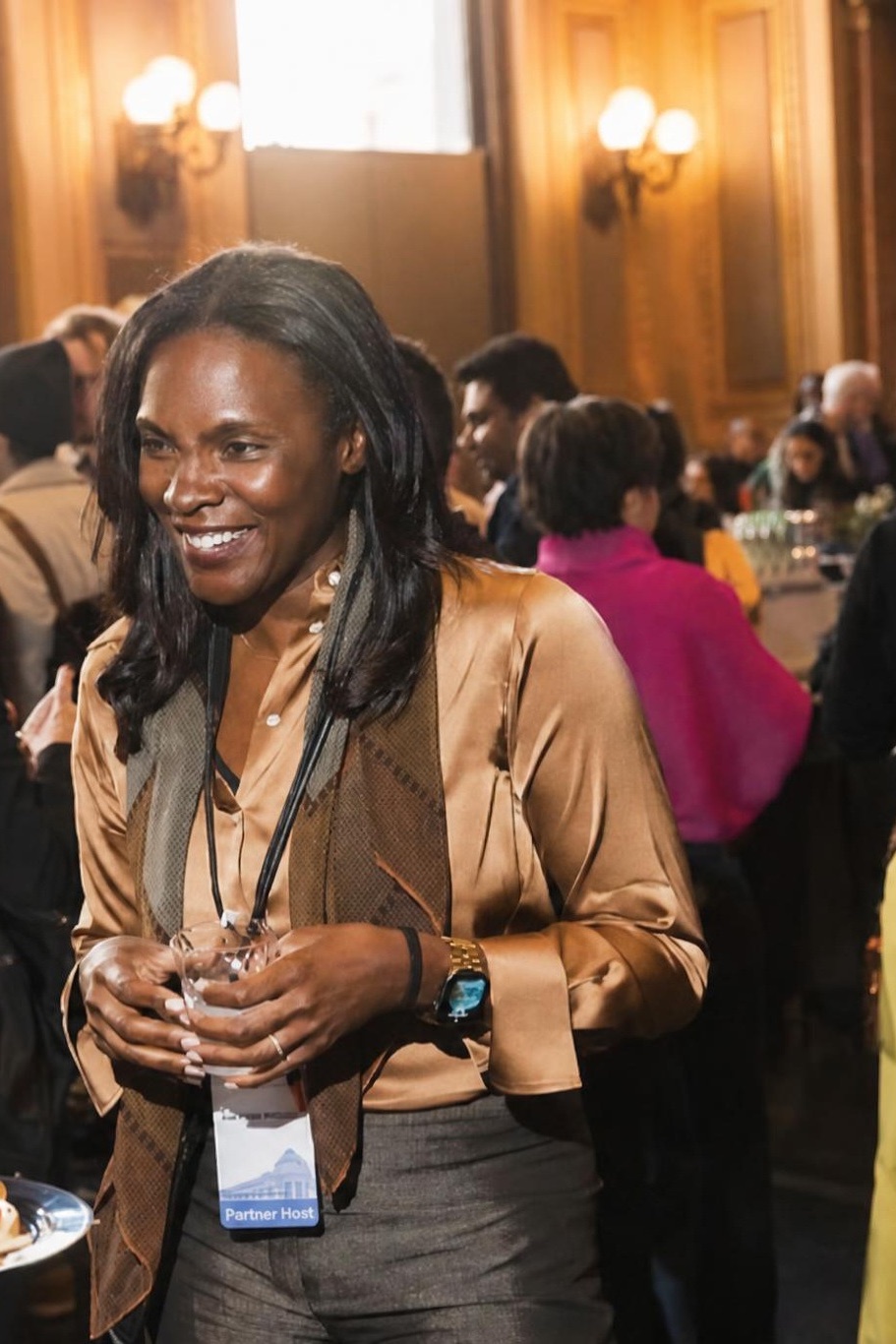 Kali Fields Williams smiling in conversation at a leadership event
